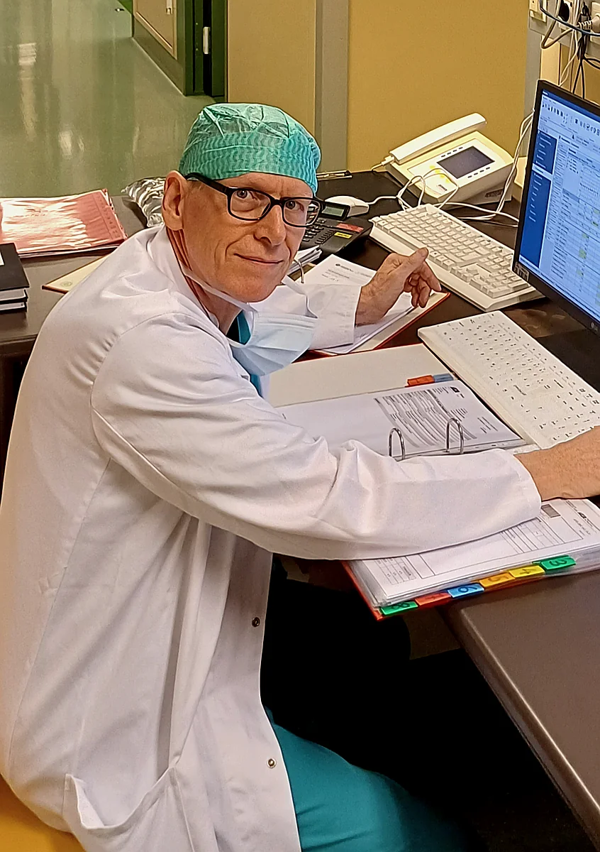 Prof. Ihra reviewing patient records